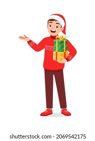 young man holding box present in christmas