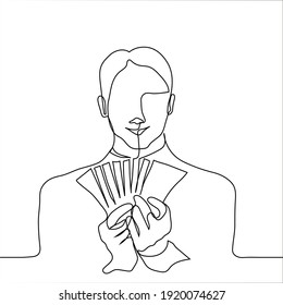 young man holding a bundle of money in the shape of a fan - one line drawing. guy shows bills of money in his hands. Concept of winning the lottery, high income, businessman with profit, 