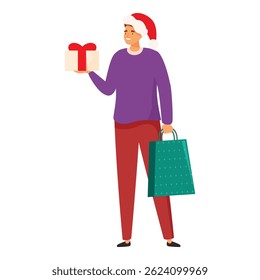 Young man is holding a christmas present and a shopping bag