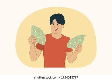 Young man holding fan of cash money concept