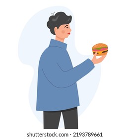 Un joven está sosteniendo una hamburguesa. Un tipo con una camisa azul ofrece comer una hamburguesa en un diseño plano con un fondo blanco.