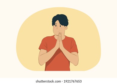 Young man holding hands folded in pray concept