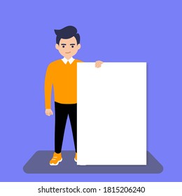 Young man holding white blank poster, banner. A place to post your advertisement or other information. Advertising.