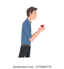 Un joven tiene un corazón. Ilustración vectorial.