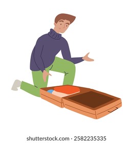 Young man kneeling while packing an open suitcase isolated vector illustration