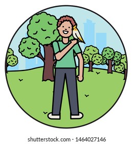 young man with little bird in the park