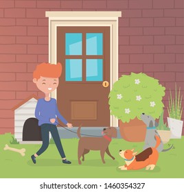young man with little dogs mascots in the house garden