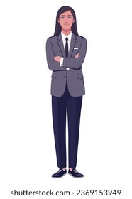 A young man with long hair in a jacket and trousers stands with his arms crossed on his chest