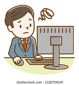 Young man looking at a computer with a troubled look