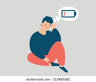 Young man looks stressed with overweight sits on the floor with a discharged battery in his thoughts. Tired boy hugs his knees and has an emotional burnout. Mental health disorder, depression, stress.