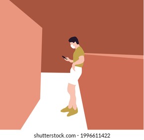 Young man in medical mask standing at street and texting message on smartphone. Concept of social distancing and technology.
