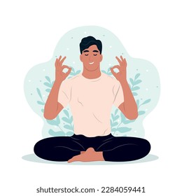 Joven meditando con los ojos cerrados y las piernas cruzadas afuera. Día Internacional del Yoga. El niño está haciendo su pasatiempo favorito.