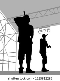 Young man with a microphone reads a rap. Stylized image on theme of hip hop