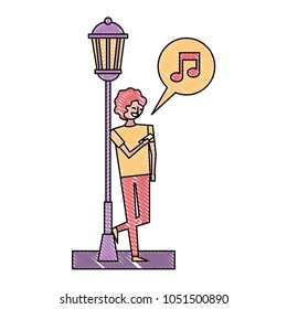 young man with mobile music speech bubble standing near lamp post