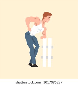 Young man with muscular body posing near fence. Cartoon character of pin-up male model. Handsome smiling guy in white t-shirt and blue pants. Flat vector design