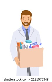 Young man pharmacist in white coat holding paper bag with medicines and other goods bought in a pharmacy. Male drugstore seller gives the order to the buyer. Drugstore worker isolated on white