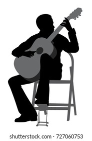 Young man playing acoustic guitar 