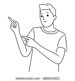 Young Man pointing away hands together and showing or presenting something while standing and smiling