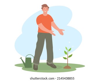 El joven está orgulloso de sí mismo. El hombre plantó un árbol. El personaje se para y señala con las manos en un árbol.