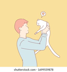 Young man raises the cat and smiles seeing the cat.Hand drawn style vector design illustrations.