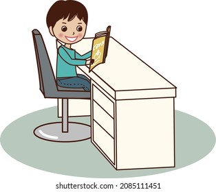 A young man reading a book at a study desk.