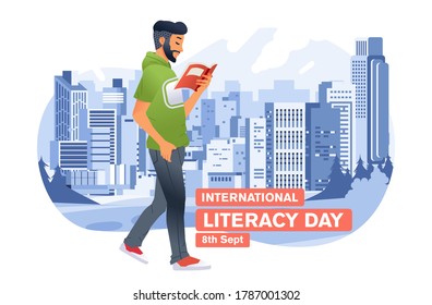 young man reading book while walking in outdoor in city park with city building as background for international literacy day. used for banner, poster and other