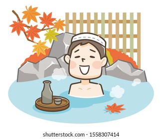 Young man relaxing traditional hot spring onsen bath on vacation