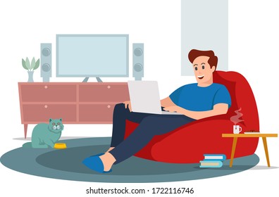 A young man is relaxing while working inside the house
