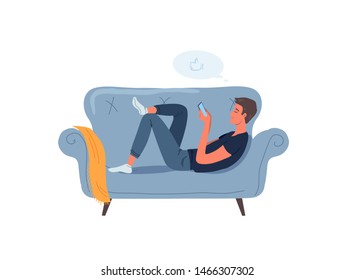 Young man resting on the grey sofa 