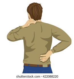 Young man rubbing his painful back. Pain relief, chiropractic concept