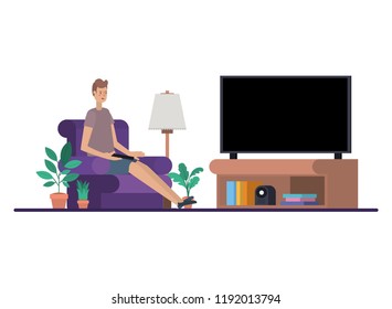 young man seated in the sofa watching tv