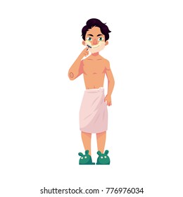 Young man shaving his beard, morning hair removal procedure, cartoon vector illustration isolated on white background. Front view portrait of young man shaving his face, wrapped in towel