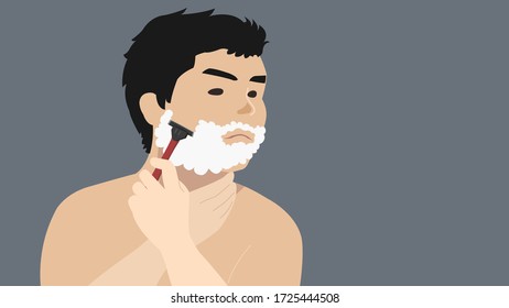 Young man shaving with razor