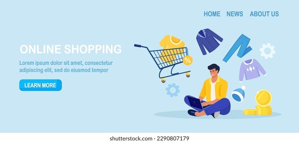 Young man shopping online using laptop, pay with mobile app. Customer choosing modern apparel, wearing, accessories for wardrobe. Internet garment shop, sale. Shopping cart, trolley with garments