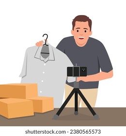 Young man is showing clothes in front of smartphone live streaming at his shop. Live online selling. Flat vector illustration isolated on white background