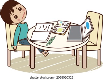 Young man sighing face down on desk while studying.