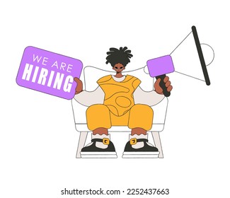 A young man sits in a chair and holds a megaphone in his hand. Good for job search topics.