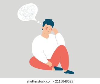 Young man sits on the floor and has anxiety. Stressed boy has confused thinking looks upset. Depressed adolescent male with tangled thoughts has psychological problem. Mental health disorders concept.