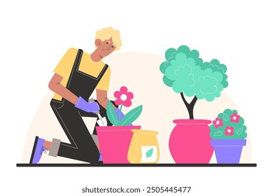 A young man sits and plants flowers in pots