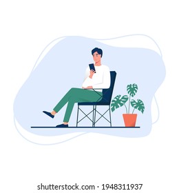 Young man sitting in the chair with a smartphone. Vector illustration