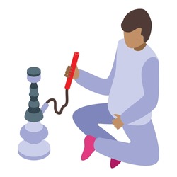 Young man sitting cross legged is preparing a hookah pipe