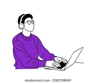 Young man sitting at the desk, working at laptop.
