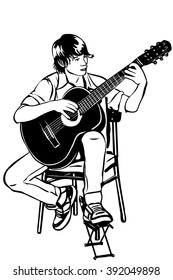  young man sitting on the acoustic guitar plays music