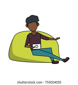 Young man sitting on bean bag