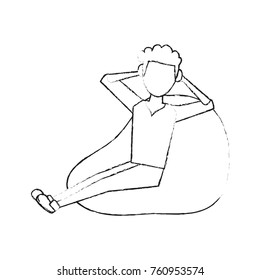 Young man sitting on bean bag