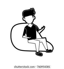 Young man sitting on bean bag