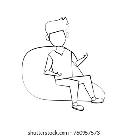 Young man sitting on bean bag