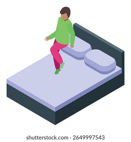Young man is sitting on the edge of his bed, wearing pajamas, as he gets ready to go to sleep