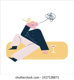 Young man sitting on floor suffering from hangover feeling unwell in morning