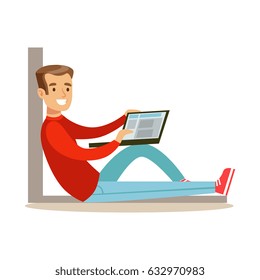 Young man sitting on the floor with his laptop, colorful character vector Illustration